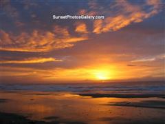 Sunset Photos Gallery - Ocean Beach Sunset with orange and red sky and cloud colors